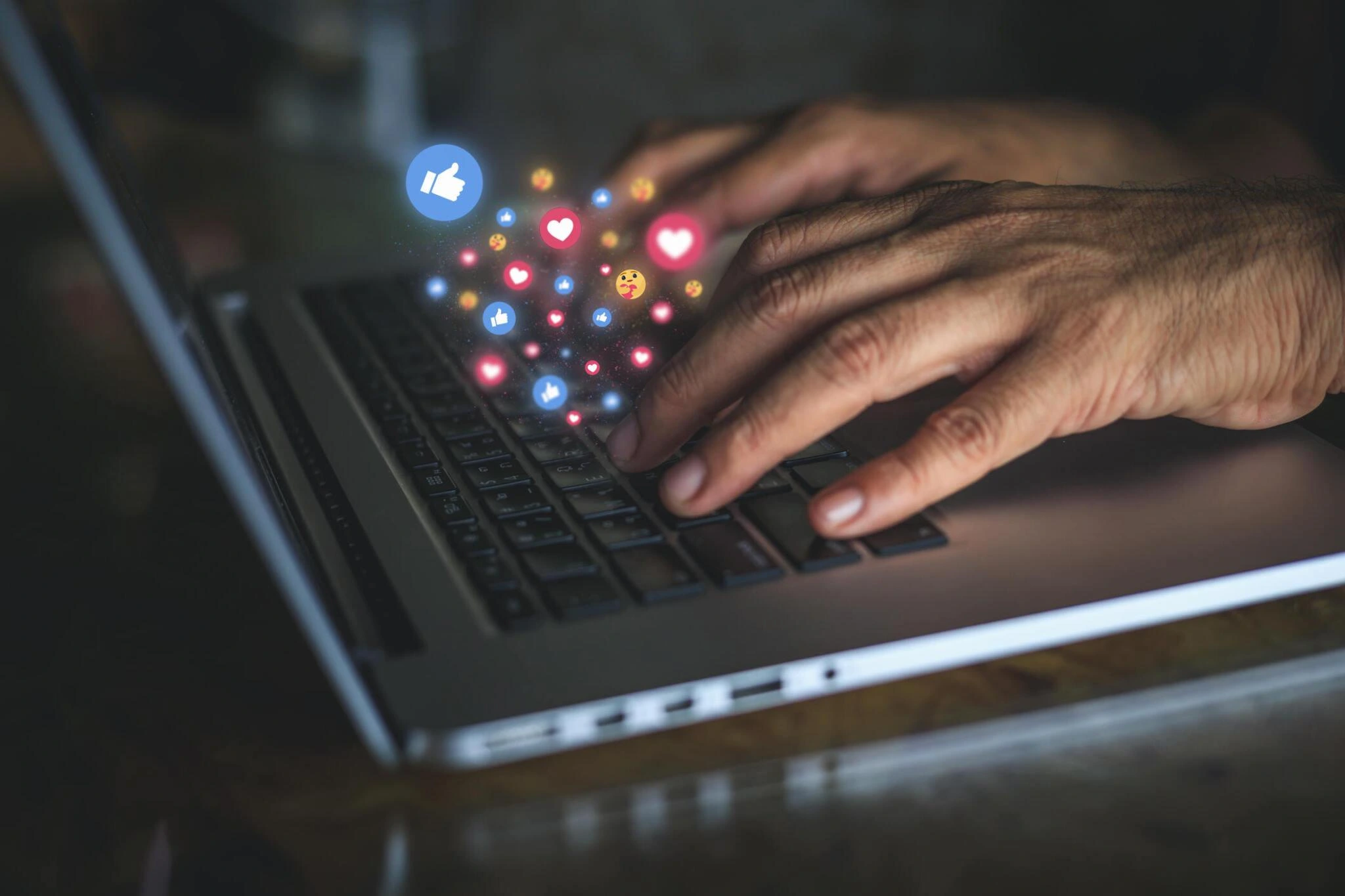 A person using laptop for social media marketing.